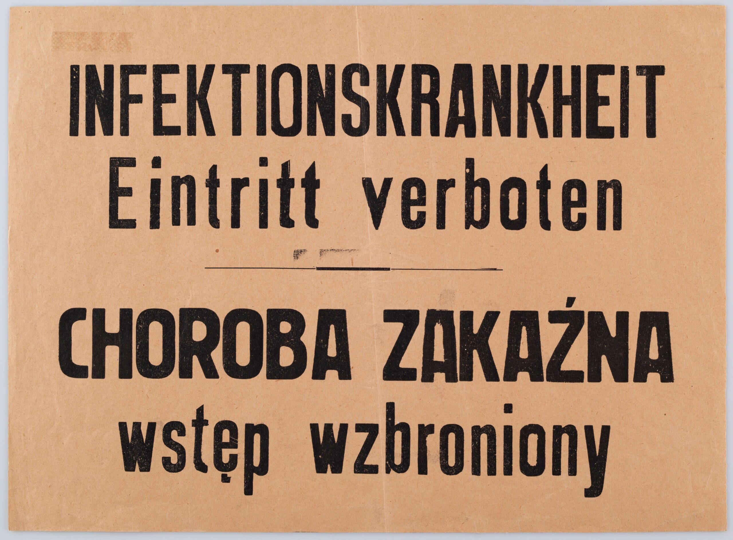 Kartka z zakazem wstępu ze względu na chorobę zakaźną. Ogłoszenie drukowane na pomarańczowym papierze, dwujęzyczne (po niemiecku i po polsku) z napisem 